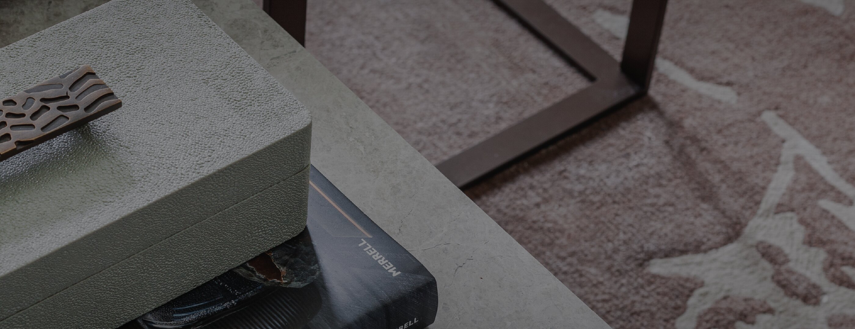 About hero detail image with box, book and rug
