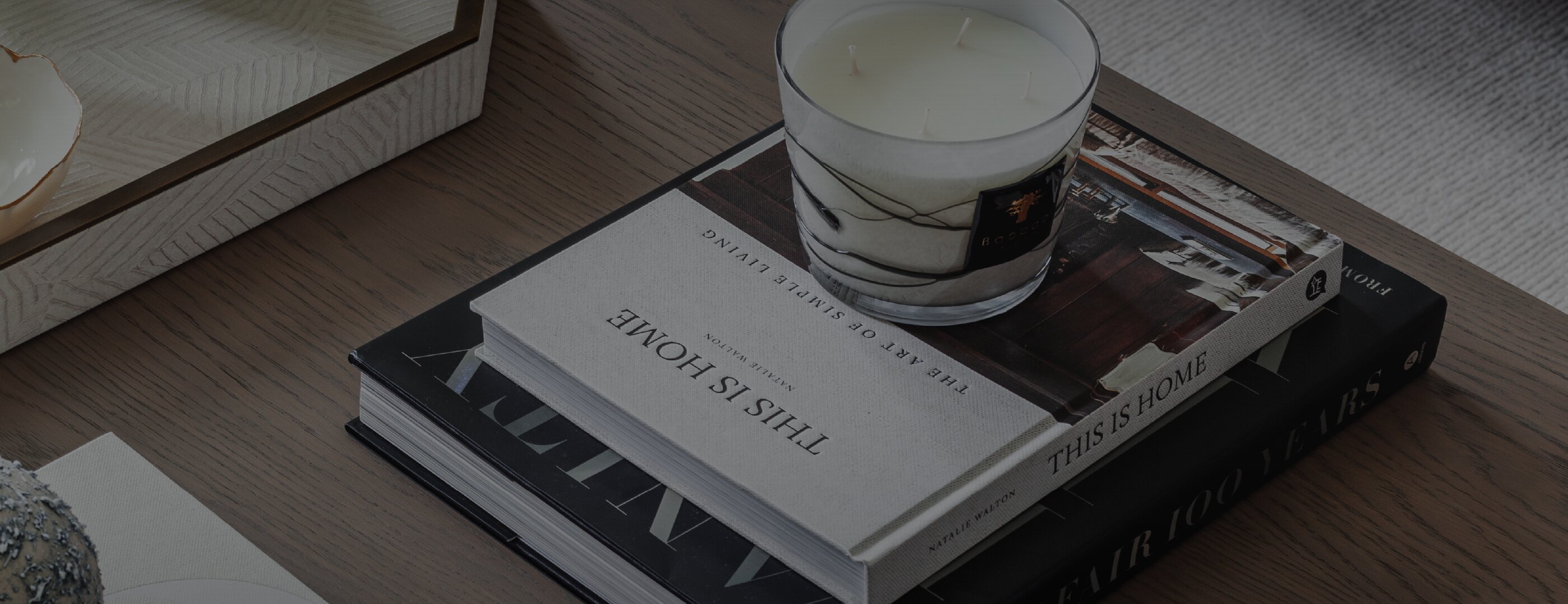 Contact hero coffee table books and candle image